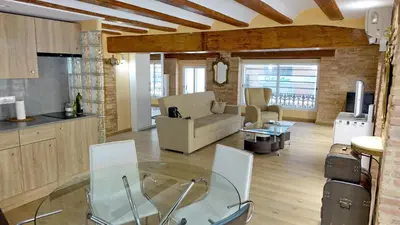a kitchen and a living room with a glass table at Lepanto Centro Valencia1 in Valencia
