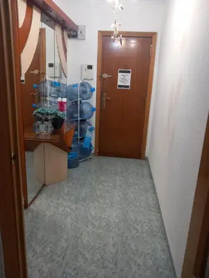 a hallway with a door leading to a room at habitación grande en piso compartido con 2 adultos in Valencia