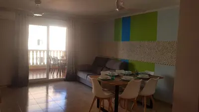 a living room with a table and chairs and a couch at SUN&BEACH Moncofar in Moncófar