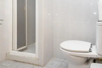 a bathroom with a toilet and a shower at Solimar, 5-24 in Cullera