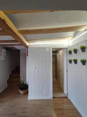 an open hallway with potted plants on the walls at EL RINCÓN deMANUELA in Requena