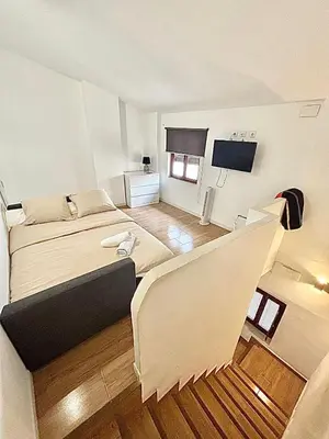a large room with a bed and a couch at EL RINCÓN deMANUELA in Requena