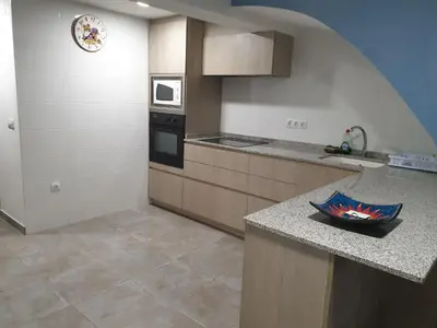 a kitchen with a counter and a counter top with a bowl at Casa Castillo de la Estrella in Segorbe