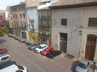 a group of cars parked on a city street at Casa Castillo de la Estrella in Segorbe