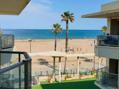 a view of the beach from the balcony of a building at NON STRESS Arena Primera línea de Playa in Valencia