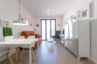 a living room with a couch and a table at Apartamentos Mercado Central in Valencia