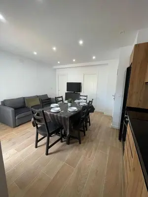 a living room with a table and chairs and a couch at UIM Mediterraneo Columbretes 1 Wifi in Puerto de Sagunto