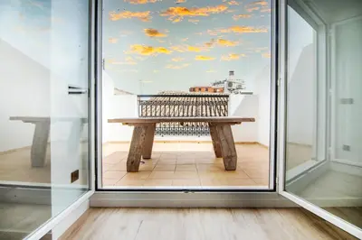 a picnic table in a room with a window at VLC HOST- Eixarchs in Valencia
