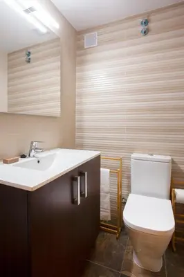 a bathroom with a toilet and a sink at Casa rural Torre Buena Vista a 40 minutos de Valencia con gran jacuzzi y vistas maravillosass in Benafer