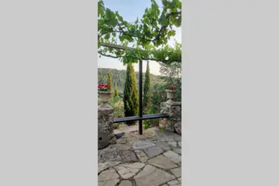 a view from a window of a patio with a tree at La Casa de Piedra, una ventana al paraíso in Matet
