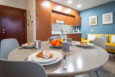 a dining room with a table with plates of food on it at MD Vitoria City Center in Valencia