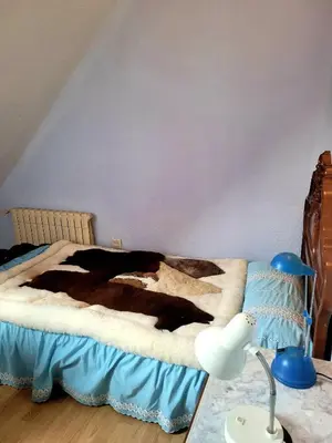 a bed in a room with a lamp and a table at Palau 2 in Valencia