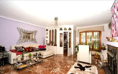 a living room with a couch and a fireplace at Palau 2 in Valencia