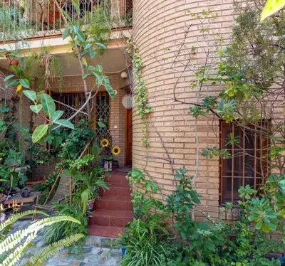 a brick house with a staircase leading to the front door at Palau 2 in Valencia