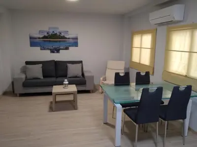 a living room with a glass table and a couch at APTMUNDO ALTAMAR.- Precioso apartamento 1ª planta + terraza . Para 4 in Puerto de Sagunto