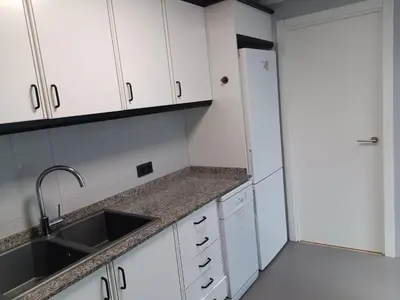 a bathroom with a toilet and a sink with two plants at APTMUNDO ALTAMAR.- Precioso apartamento 1ª planta + terraza . Para 4 in Puerto de Sagunto