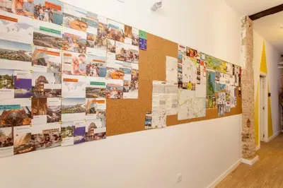 a wall covered in pictures and photos on a wall at COOL LOFTS center valencia in Valencia