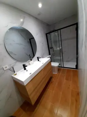 a bathroom with a sink and a mirror at UIM Mediterraneo PB Columbretes 12 Wifi in Puerto de Sagunto