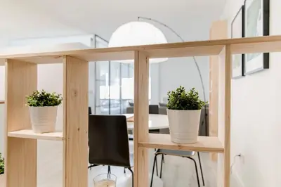 two potted plants sitting on shelves in a room at Loft en el corazón de Valencia in Valencia