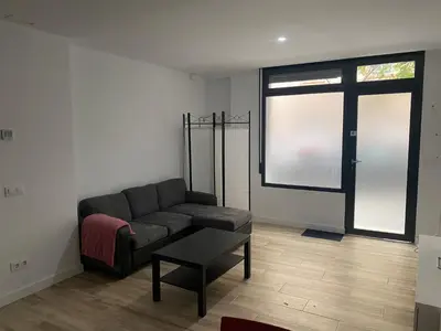 a living room with a couch and a table at Cozy flat in La Petxina_A in Valencia