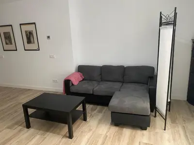 a living room with a couch and a table at Cozy flat in La Petxina_A in Valencia