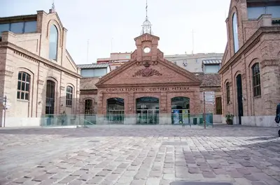 a large brick building with a clock tower at Cozy flat in La Petxina_A in Valencia