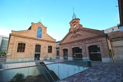 a large brick building with a church at Cozy flat in La Petxina B in Valencia