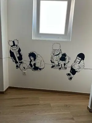 a wall with drawings of cats on a wall at Beach & Arts Hostel Valencia in Valencia
