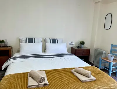 a bedroom with a large bed with towels on it at UIM Mediterraneo ATICO San Pedro Wifi in Puerto de Sagunto