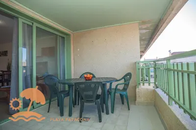 a black table and chairs on a balcony at Patacona Green Holiday in Valencia