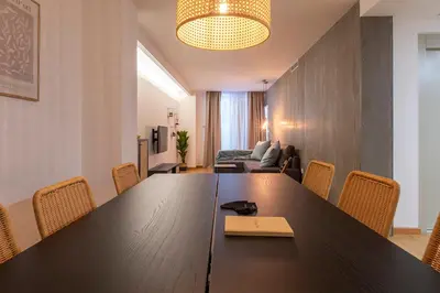 a conference room with a large wooden table and chairs at Moontels Paseo de Ruzafa in Valencia