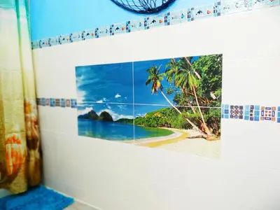 a picture of a beach on a wall at Casa ideal para familias con patio y 3 baños in Valencia