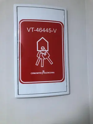 a red and white sign on a wall at Villa Bruno&Playa de Valencia in Valencia