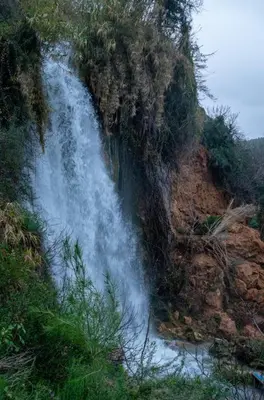 a waterfall on the side of a rocky mountain at CASA BAUTISTA - ROTGLÀ in Rotglá y Corbera