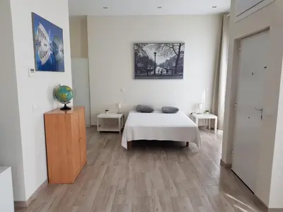 a bedroom with a bed in a white room at Studio Sorolla - Spacious studio near Valencia's beaches in Valencia