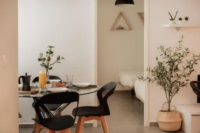 a dining room with a table and chairs at Apartamentos FV Flats Valencia - Mestalla 7 in Valencia