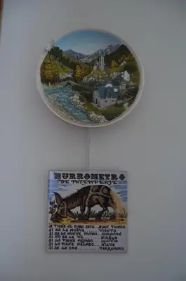 a plate with a picture of a dinosaur on a wall at Casa el Castell in Eslida
