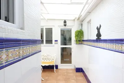 a white table and chairs on a patio at Best Valencia Beach Rooms-Shared Flat in Valencia
