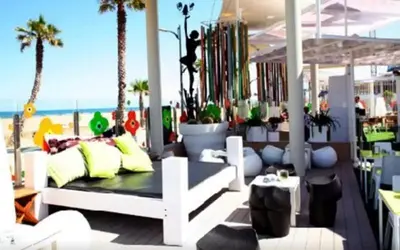 a white bench on a balcony with the beach at BEACH VALENCIA LUXURY A40-13 Apartment with terrace and sea views in Valencia
