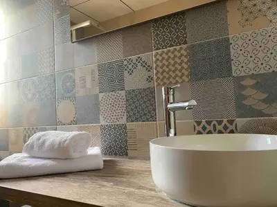 a bathroom with a white tub sitting on a counter at Apartamentos LOSA RURAL in Losa del Obispo