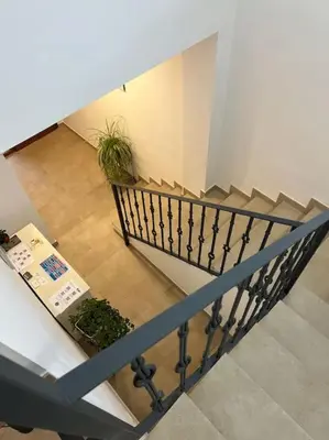 an overhead view of a staircase with potted plants at Apartamentos LOSA RURAL in Losa del Obispo