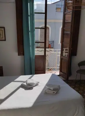 a bed with two napkins on top of it at Gran apartamento cerca de Ruzafa in Valencia