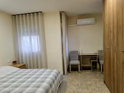 a bedroom with a bed and a desk and a window at Entire Apartment near Valencia - 2 Bedrooms & 2 Bathrooms in Paterna