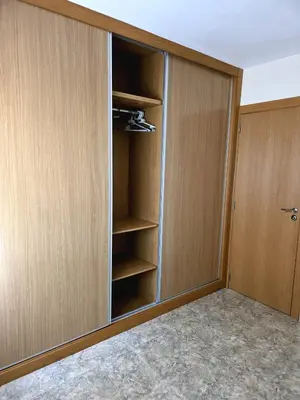 a closet with wooden panels and a door at Entire Apartment near Valencia - 2 Bedrooms & 2 Bathrooms in Paterna