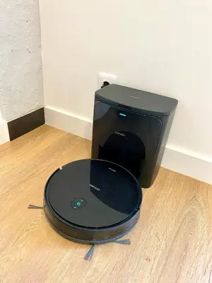 a black computer monitor sitting on a wooden floor at Puerto Playa Paradise in Puerto de Sagunto