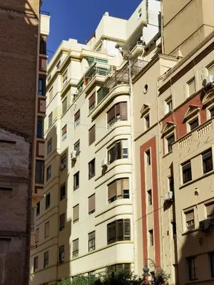 an apartment building in the middle of two buildings at City Hall Central Market in Valencia