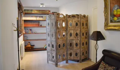 a large wooden cabinet in a living room at Valencia Green Penthouse in Valencia