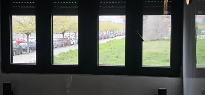 four windows in a room with a view of a street at A7 ViviendaTuristicaValencia Arte in Valencia