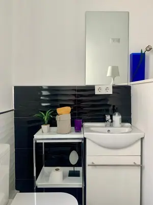 a small bathroom with a sink and a toilet at Alquilo Habitación individual con aseo privado solo Chicas, only girls in Valencia