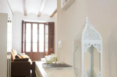 a room with a kitchen with a counter top with a window at Singular Apartments Station in Valencia